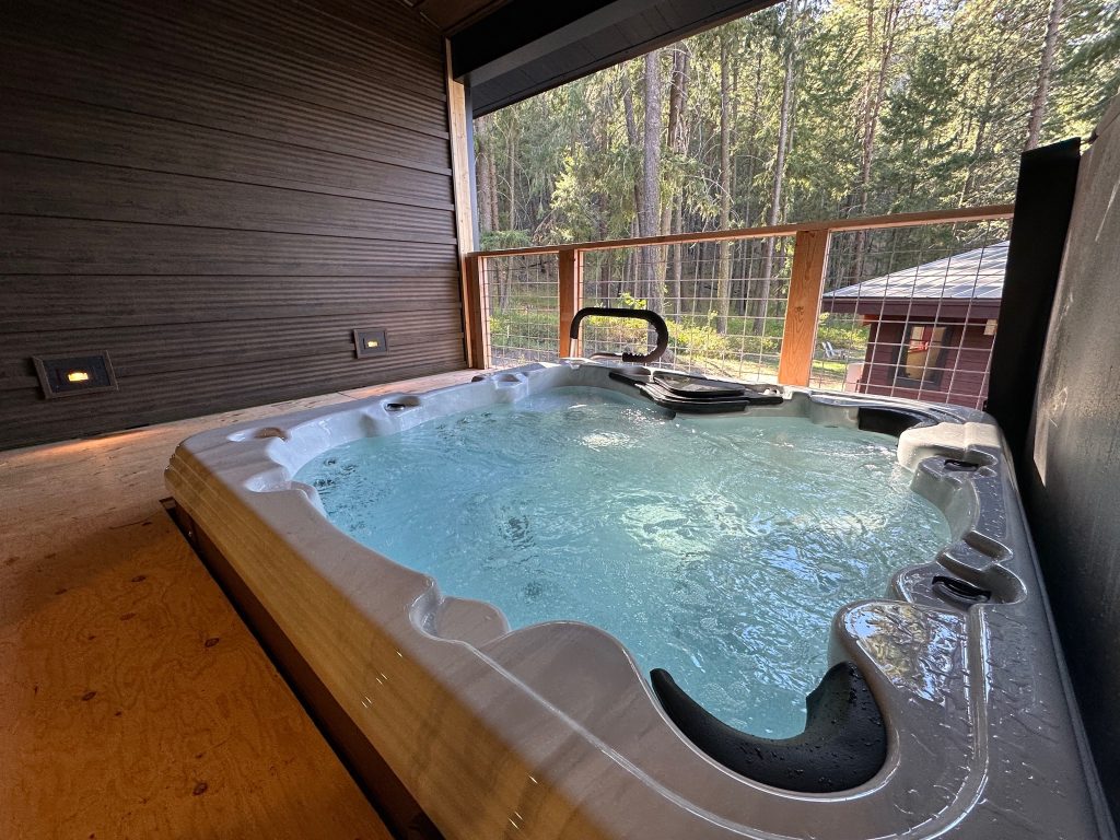 Mazama cabin rental with a relaxing hot tub spa, perfect for unwinding after a day of outdoor activities.