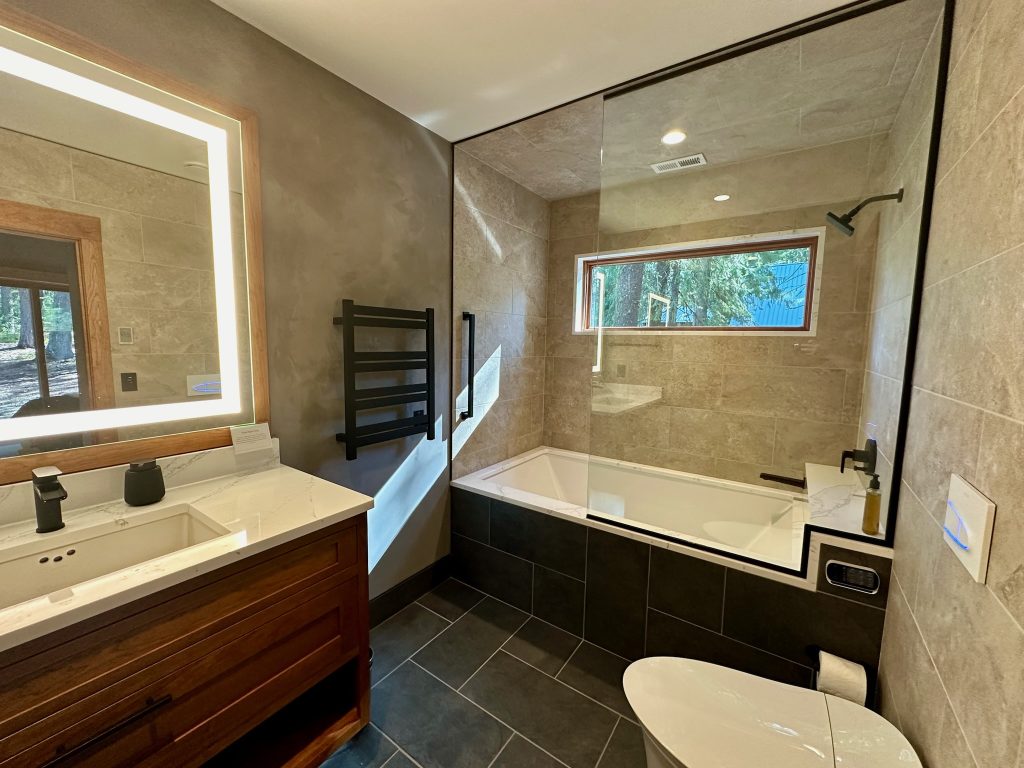 Luxury cabin rental in Mazama with a spa-like soaking tub, bidet, and modern toilet for a relaxing and comfortable stay.