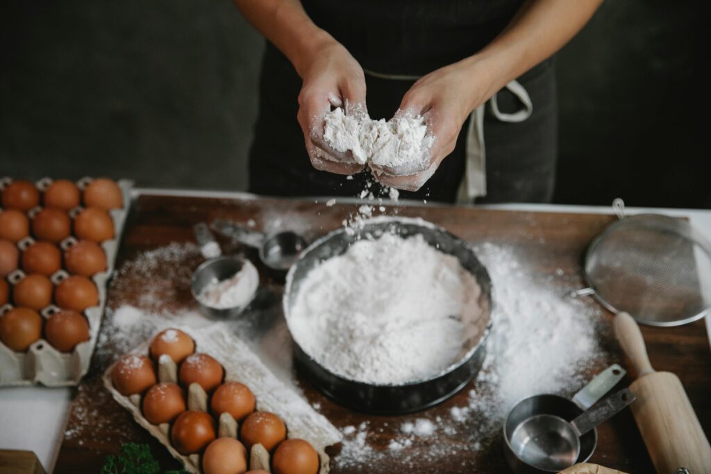 Guest baking on Pinehaven’s large 13-foot kitchen island in a spacious gourmet kitchen