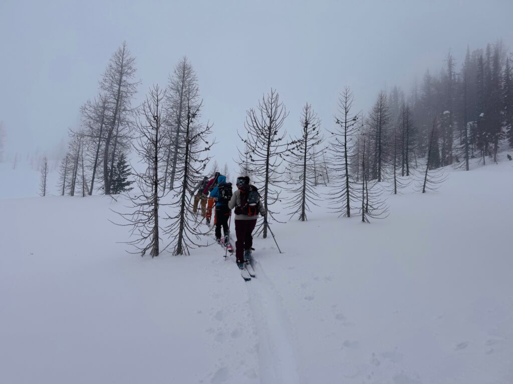Heliskiers guided through clouds and mist in the Methow Valley backcountry