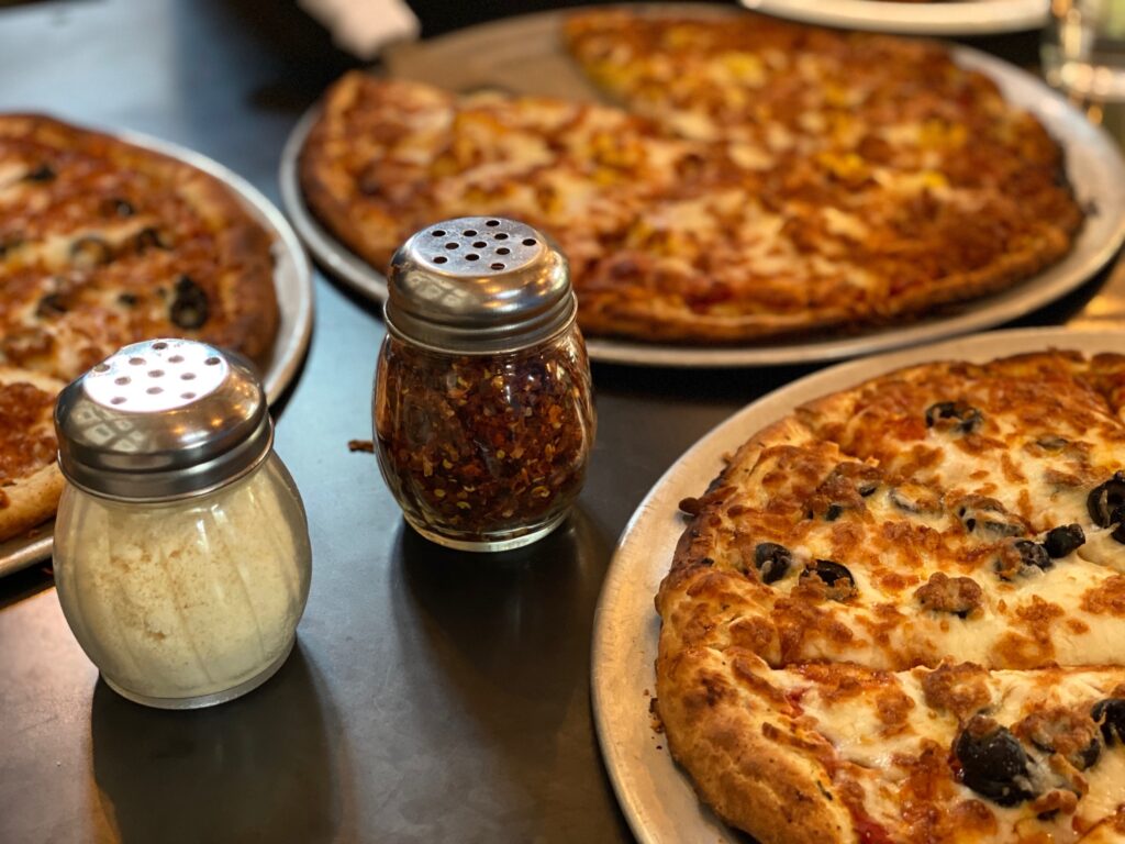 Hot pizzas on a table at Jack’s Hut in Mazama, WA, after skiing