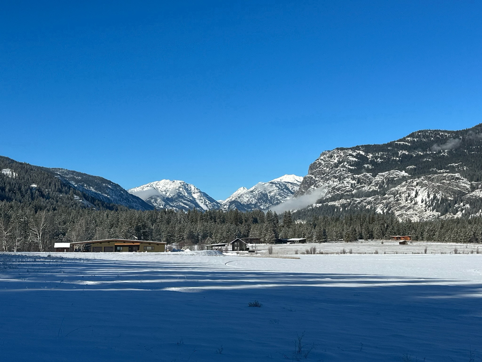 Snow-covered Last Chance peak as seen from Timberline Lane near Pinehaven