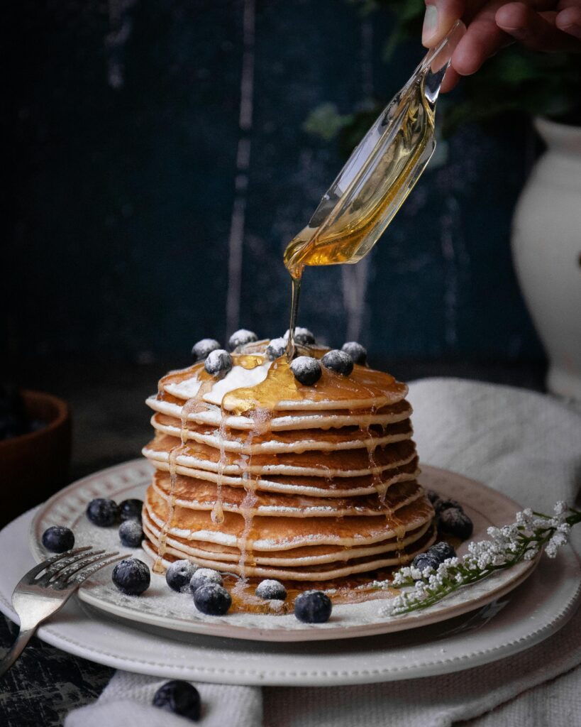 Blueberry pancakes with syrup prepared in Pinehaven’s gourmet kitchen