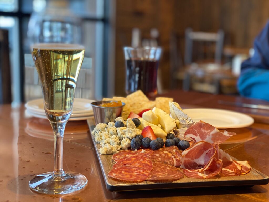 Cheese and charcuterie platter with champagne at Sun Mountain Lodge bar, Winthrop, WA