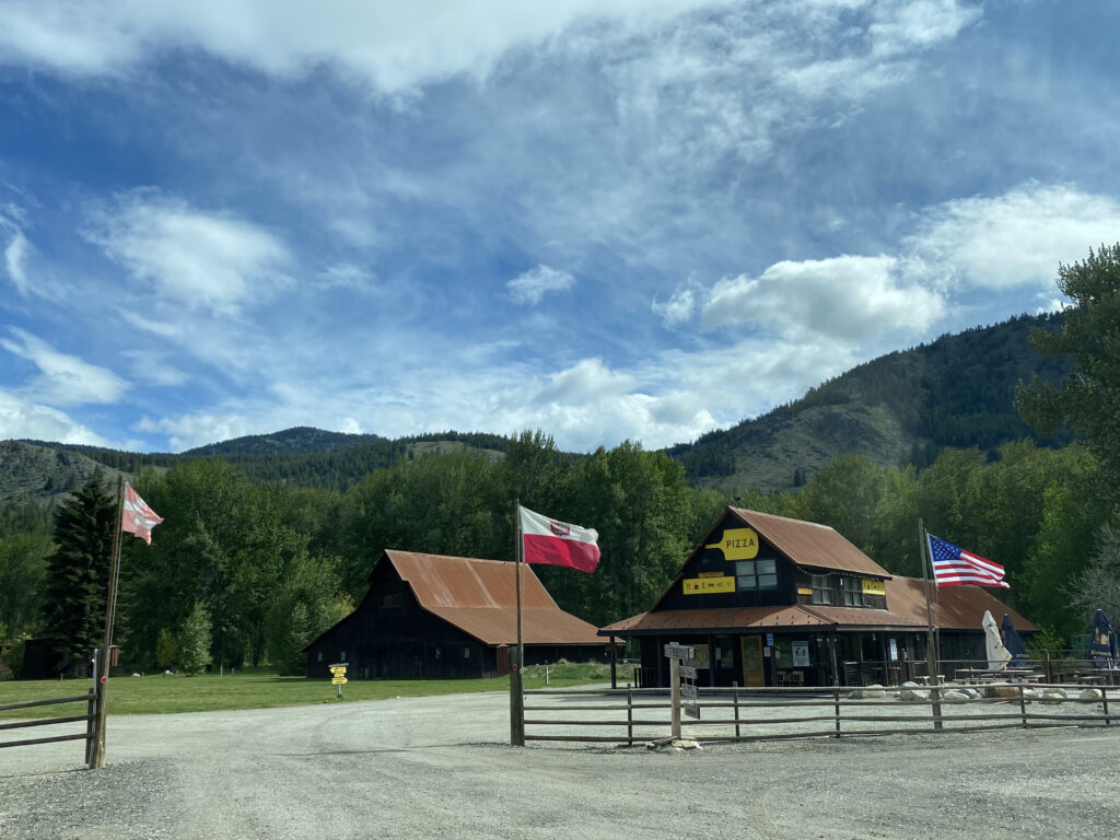 Woodstone Pizzeria at the Rolling Huts in Mazama, Washington, with outdoor seating and mountain views.